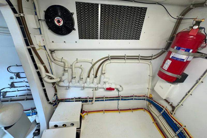 Elsewhere Yacht Photos Pics Engine room of 2013 Hatteras 60 Motor Yacht with fire extinguisher and ventilation system.