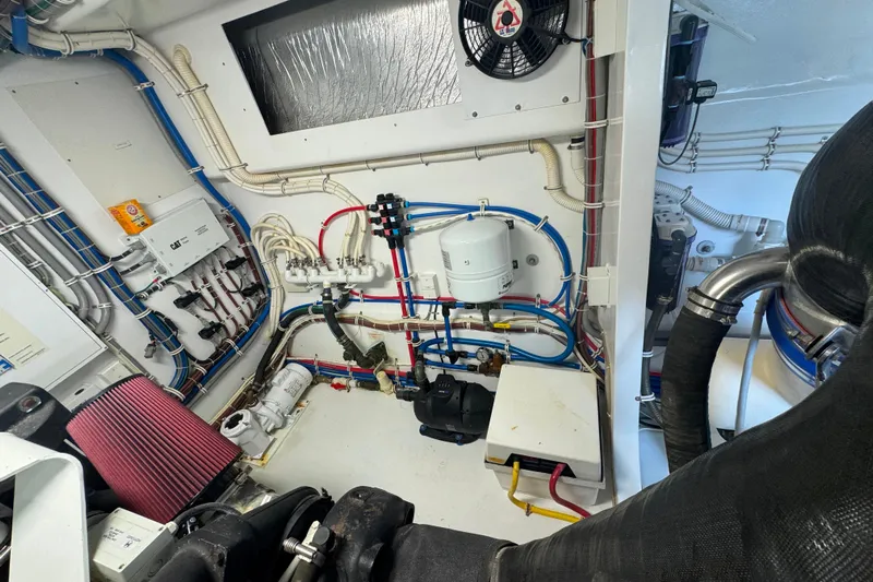 Elsewhere Yacht Photos Pics Engine room of 2013 Hatteras 60 Motor Yacht with complex wiring and machinery.