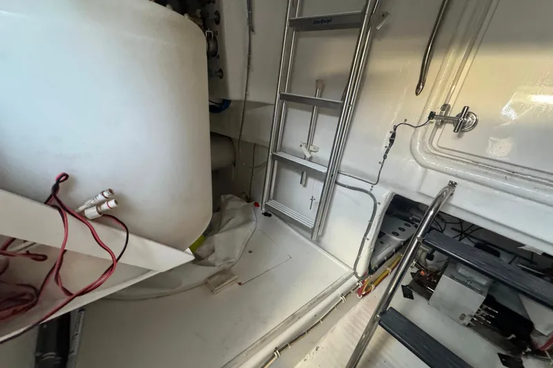 Elsewhere Yacht Photos Pics Engine room of 2013 Hatteras 60 Motor Yacht with ladder and equipment.