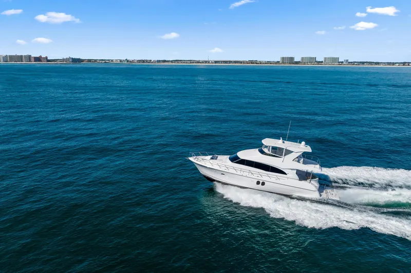 Elsewhere Yacht Photos Pics 2013 Hatteras 60 Motor Yacht cruising on open blue water.