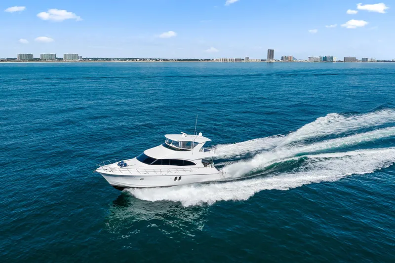 Elsewhere Yacht Photos Pics 2013 Hatteras 60 Motor Yacht cruising on open blue water.