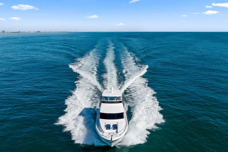 Elsewhere Yacht Photos Pics 2013 Hatteras 60 Motor Yacht cruising on open blue sea.