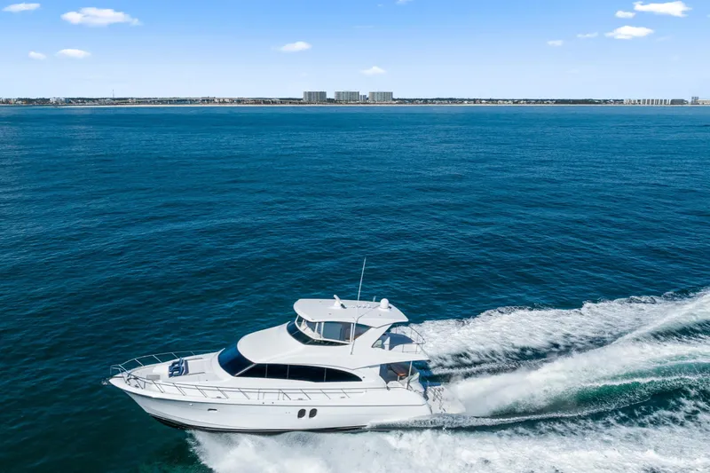Elsewhere Yacht Photos Pics 2013 Hatteras 60 Motor Yacht cruising on open blue sea.