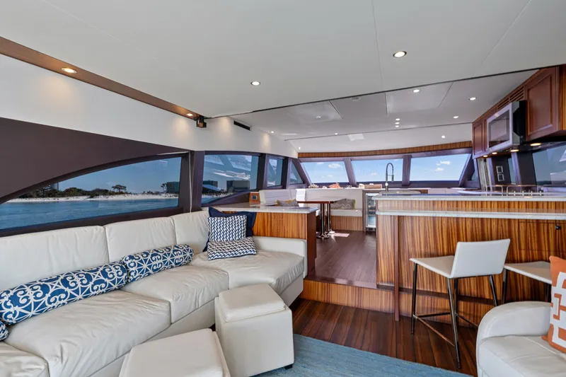 Elsewhere Yacht Photos Pics Luxurious interior of 2013 Hatteras 60 Motor Yacht with modern kitchen and seating area.