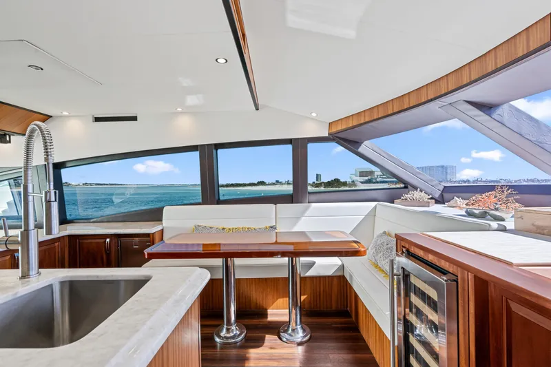 Elsewhere Yacht Photos Pics Luxurious interior of 2013 Hatteras 60 Motor Yacht with ocean view and modern amenities.