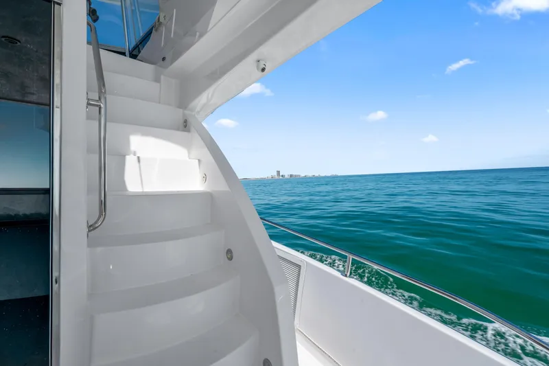 Elsewhere Yacht Photos Pics Staircase on 2013 Hatteras 60 Motor Yacht with ocean view.