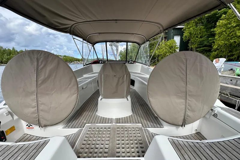 Porte Du Soleil Yacht Photos Pics 2015 Jeanneau Sun Odyssey 50 DS cockpit with covered steering wheels and canopy.