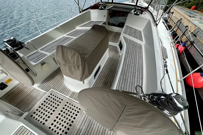 Porte Du Soleil Yacht Photos Pics 2015 Jeanneau Sun Odyssey 50 DS sailboat cockpit with teak flooring and covered seating.