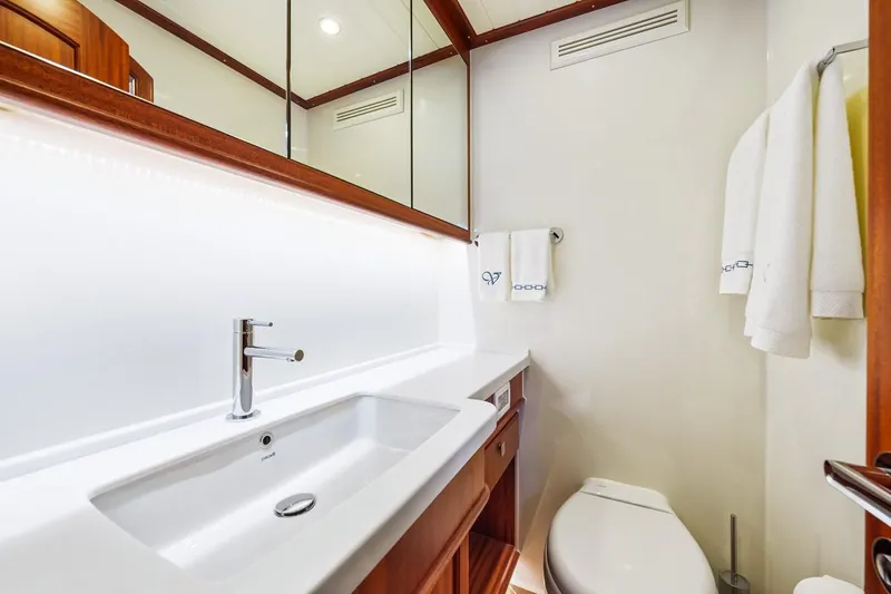 Island Girl III Yacht Photos Pics Luxurious bathroom in 2024 Vicem 62 Classic yacht with modern fixtures and elegant design.