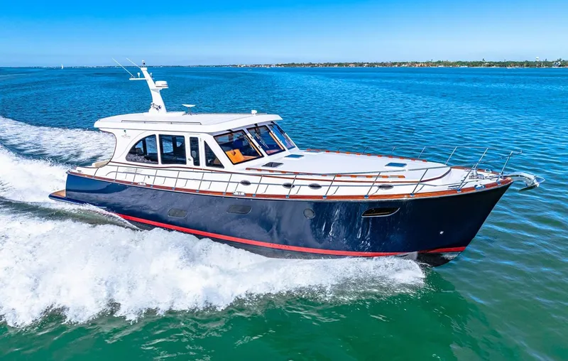 Island Girl III Yacht Photos Pics 2024 Vicem 62 Classic yacht cruising on open water, showcasing sleek design and luxury.