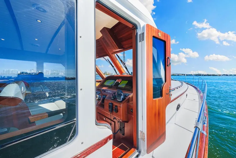 Island Girl III Yacht Photos Pics 2024 Vicem 62 Classic yacht with wooden interior, cruising on a sunny day.