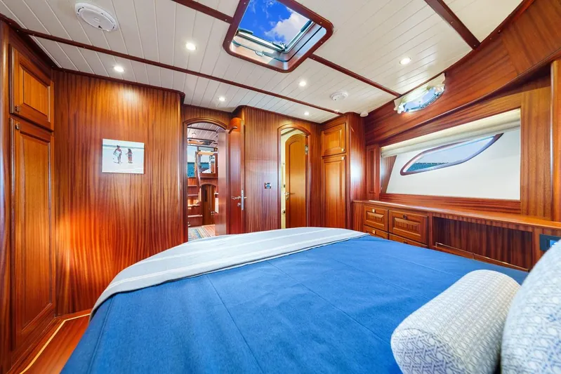 Island Girl III Yacht Photos Pics Luxurious interior of 2024 Vicem 62 Classic yacht with elegant wood paneling and skylight.