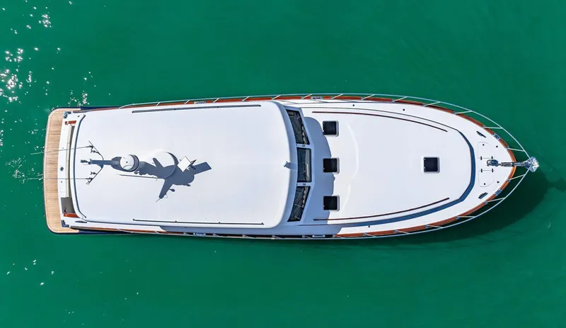 Island Girl III Yacht Photos Pics Aerial view of 2024 Vicem 62 Classic yacht on turquoise water.