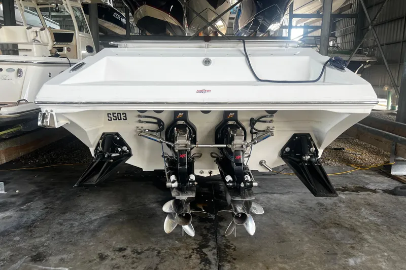 Yacht Photos Pics 2009 Fountain 42 Executioner boat with dual propellers in a storage facility.
