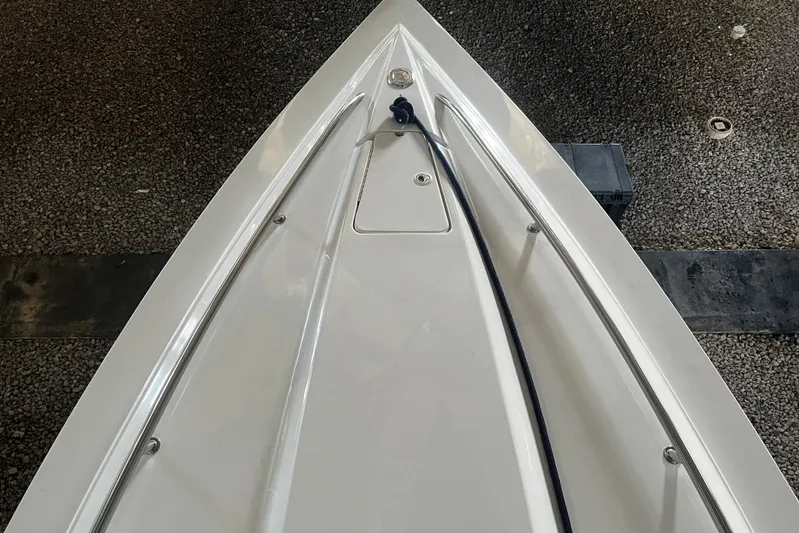  Yacht Photos Pics Bow of 2009 Fountain 42 Executioner boat on gravel surface.