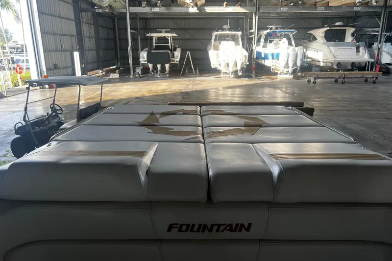  Yacht Photos Pics 2009 Fountain 42 Executioner boat in storage, surrounded by other vessels.