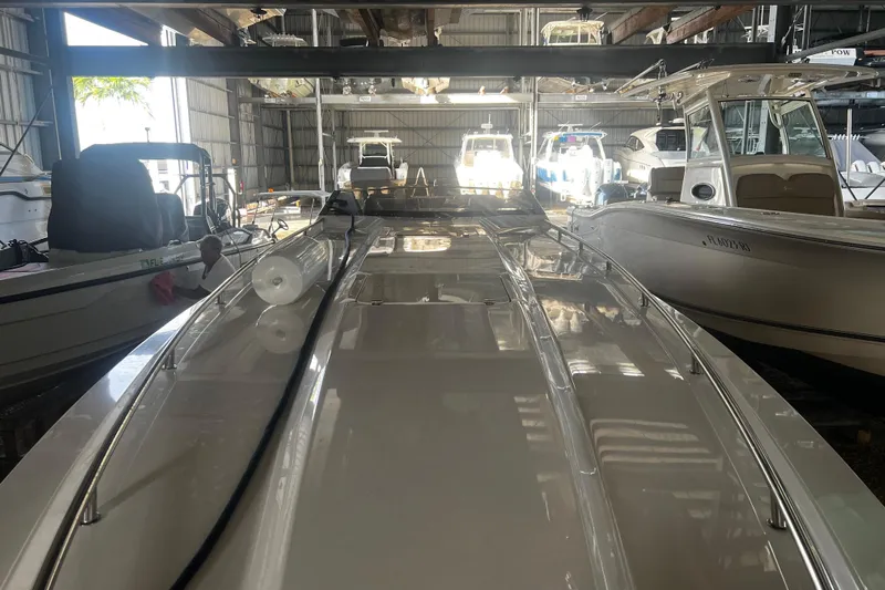  Yacht Photos Pics 2009 Fountain 42 Executioner boat in storage, surrounded by other vessels.