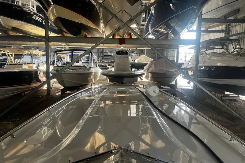  Yacht Photos Pics 2009 Fountain 42 Executioner boat in storage, surrounded by other boats in a warehouse.