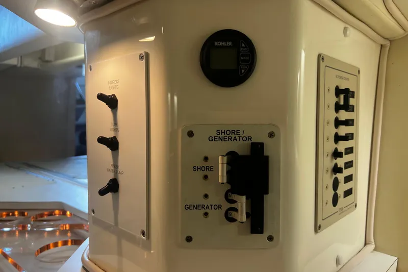  Yacht Photos Pics 2009 Fountain 42 Executioner control panel with switches and generator settings.