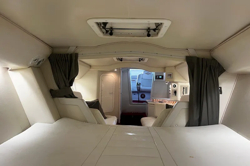  Yacht Photos Pics 2009 Fountain 42 Executioner boat interior with seating and control panel.