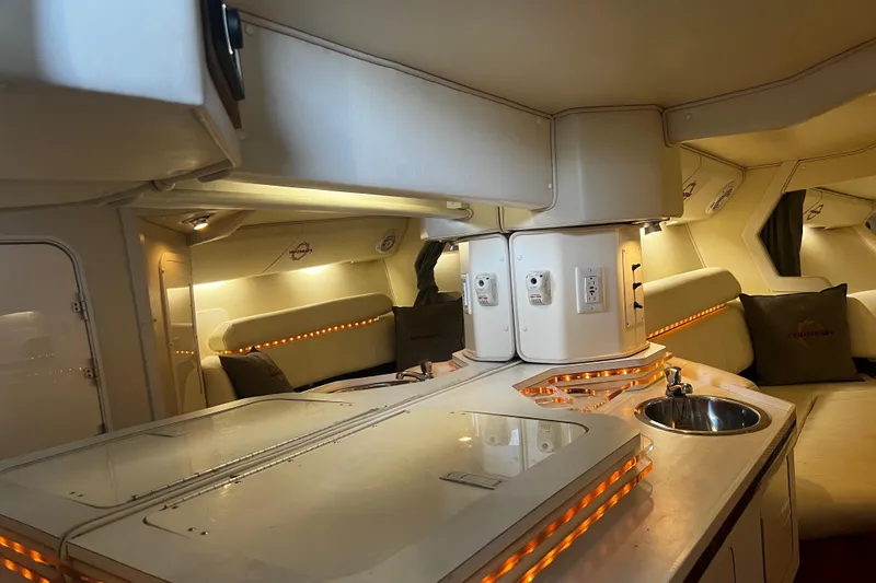  Yacht Photos Pics Luxurious interior of 2009 Fountain 42 Executioner boat with modern amenities and ambient lighting.