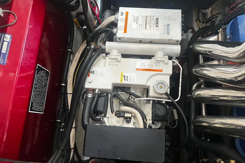  Yacht Photos Pics Engine compartment of a 2009 Fountain 42 Executioner boat, featuring detailed components and wiring.