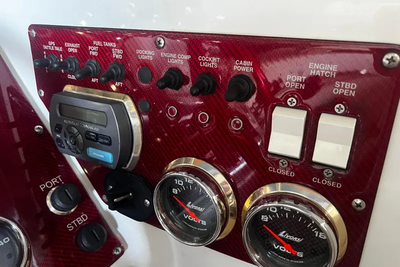  Yacht Photos Pics Control panel of a 2009 Fountain 42 Executioner boat with switches and gauges.