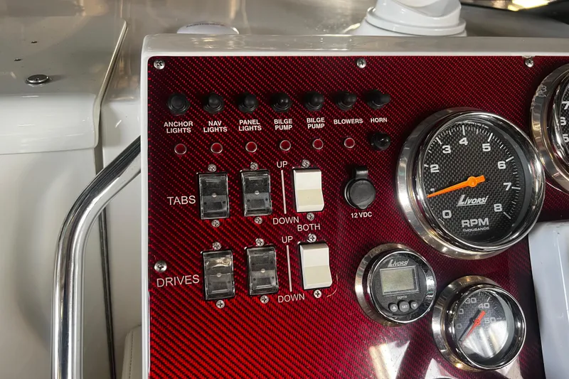  Yacht Photos Pics Control panel of 2009 Fountain 42 Executioner boat with switches and gauges.