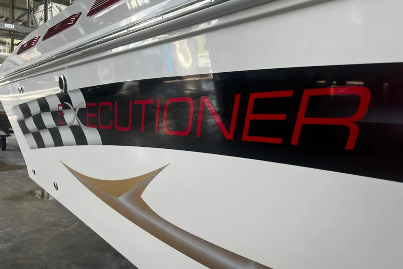  Yacht Photos Pics 2009 Fountain 42 Executioner boat with bold red lettering and checkered flag design.