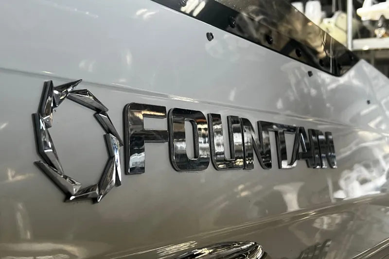  Yacht Photos Pics Close-up of 2009 Fountain 42 Executioner boat logo in chrome finish.