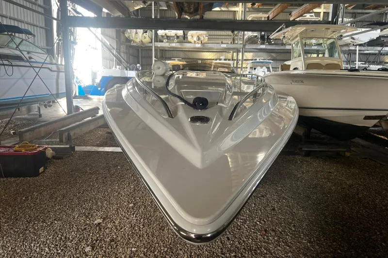  Yacht Photos Pics 2009 Fountain 42 Executioner speedboat in storage, front view, surrounded by other boats.