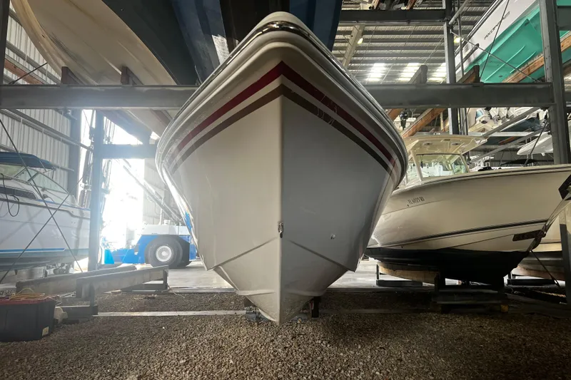  Yacht Photos Pics 2009 Fountain 42 Executioner boat in storage, front view, surrounded by other boats.