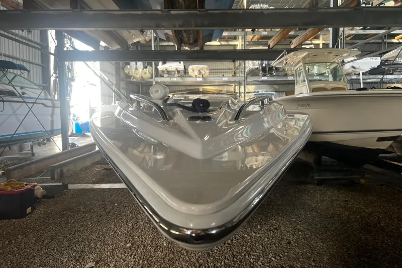  Yacht Photos Pics 2009 Fountain 42 Executioner boat stored in a marina, front view.