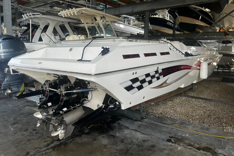  Yacht Photos Pics 2009 Fountain 42 Executioner speedboat in storage, showcasing sleek design and powerful engines.
