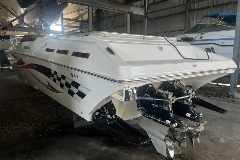  Yacht Photos Pics 2009 Fountain 42 Executioner speedboat in storage, showcasing sleek design and powerful engines.