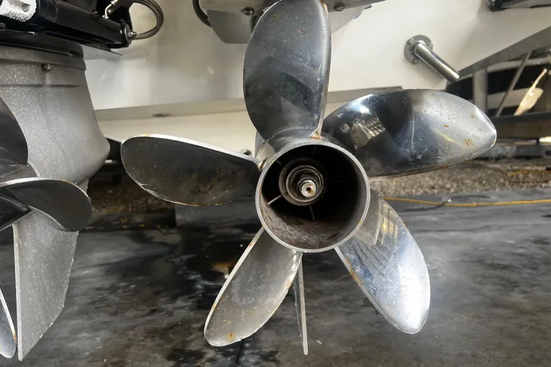  Yacht Photos Pics Close-up of a 2009 Fountain 42 Executioner boat propeller in a garage setting.