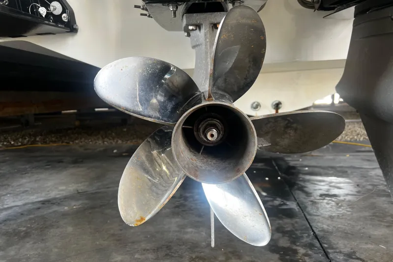  Yacht Photos Pics Close-up of a 2009 Fountain 42 Executioner boat propeller in a garage setting.