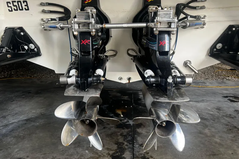  Yacht Photos Pics 2009 Fountain 42 Executioner boat with dual propeller drives in a garage setting.