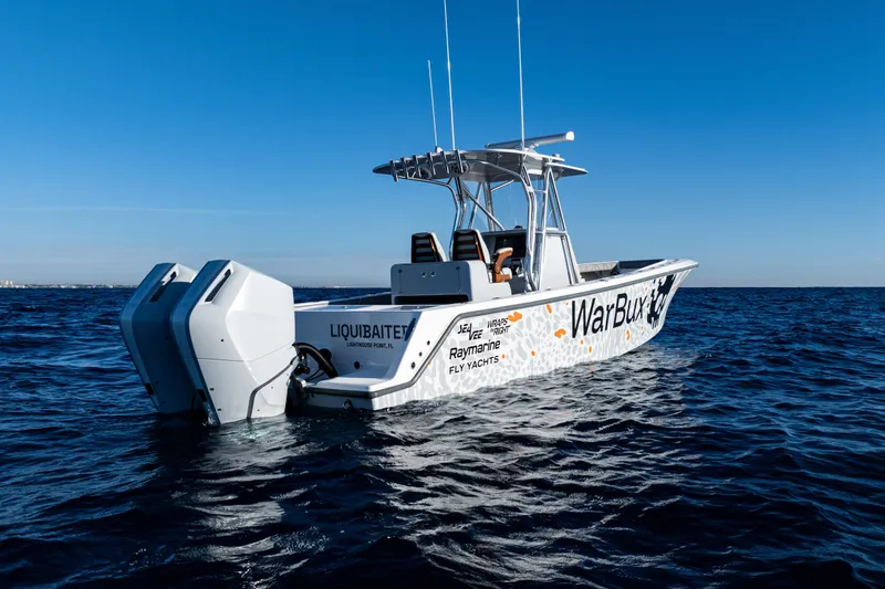  Yacht Photos Pics 2026 SeaVee 320B boat on open water, featuring dual engines and custom graphics.