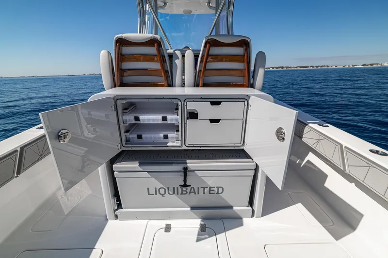  Yacht Photos Pics 2026 SeaVee 320B boat with open storage compartments and cooler on deck.