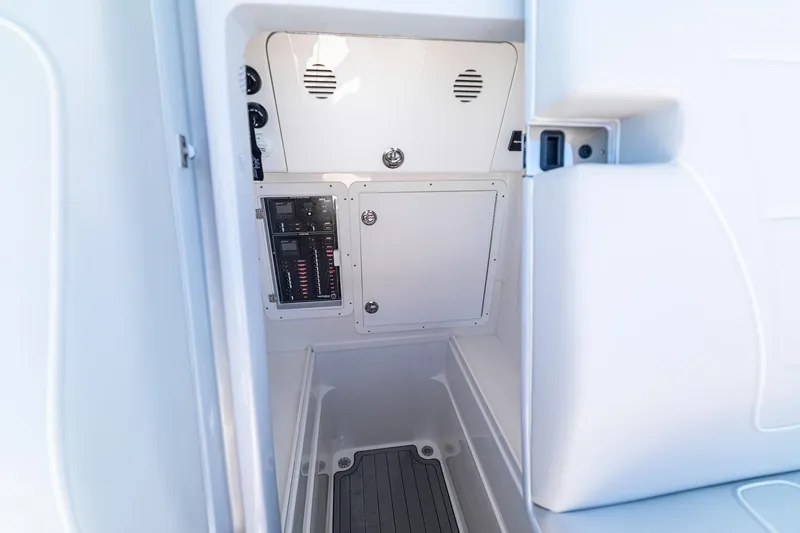  Yacht Photos Pics 2026 SeaVee 320B boat interior with control panel and storage compartment.