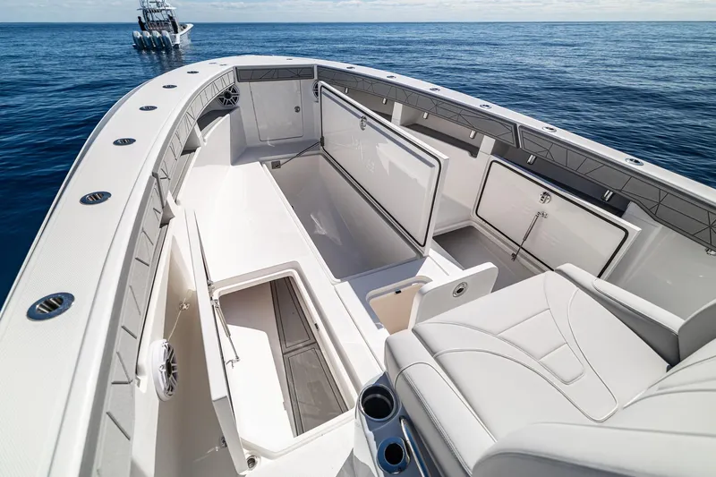  Yacht Photos Pics 2026 SeaVee 320B boat interior with open storage compartments on calm ocean.