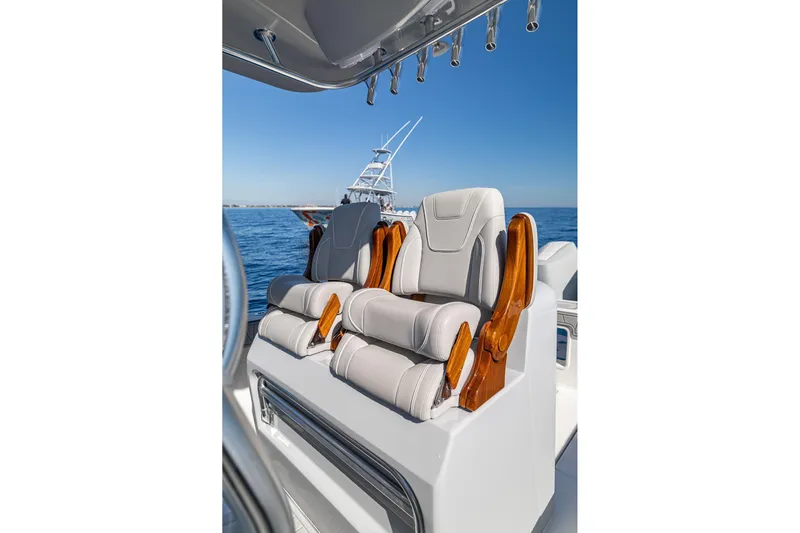  Yacht Photos Pics Luxurious seating on 2026 SeaVee 320B boat, featuring elegant design and ocean backdrop.