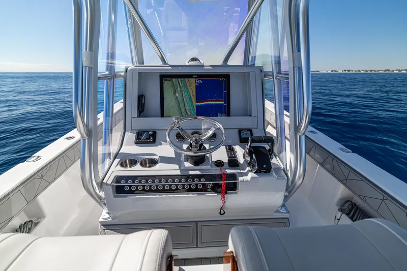  Yacht Photos Pics 2026 SeaVee 320B boat console with navigation display on open water.