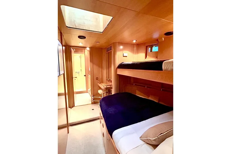 Persistence Yacht Photos Pics Luxurious 1989 Sensation yacht cabin with wooden interior and cozy bunk beds.