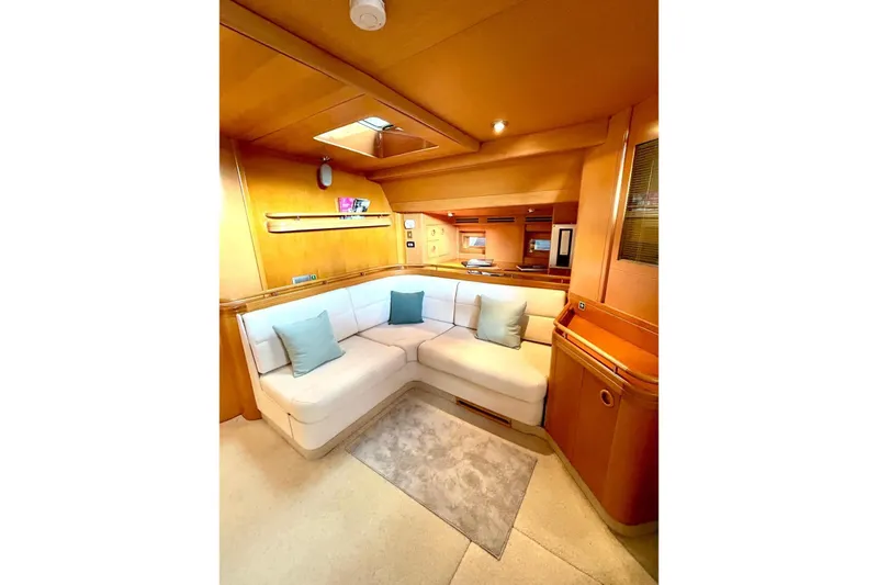 Persistence Yacht Photos Pics Luxurious 1989 Sensation yacht interior with cozy seating and elegant wood finish.