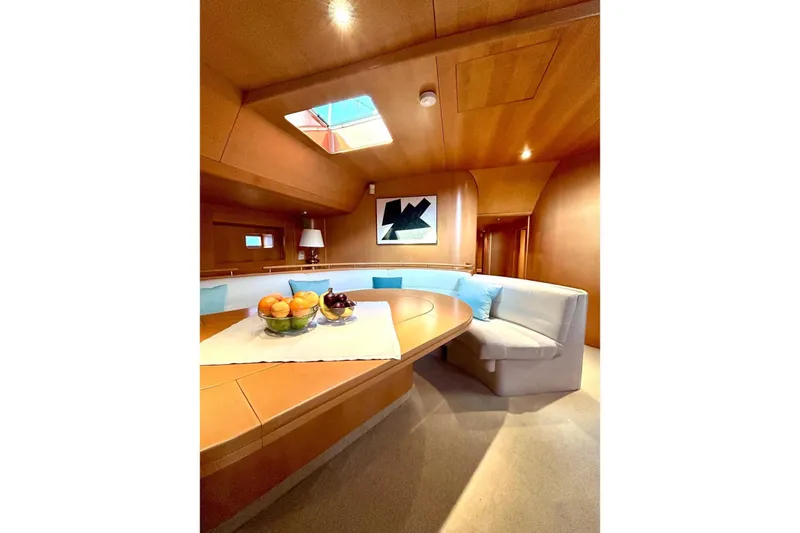 Persistence Yacht Photos Pics Luxurious 1989 Sensation yacht interior with elegant seating, skylight, and fruit centerpiece.