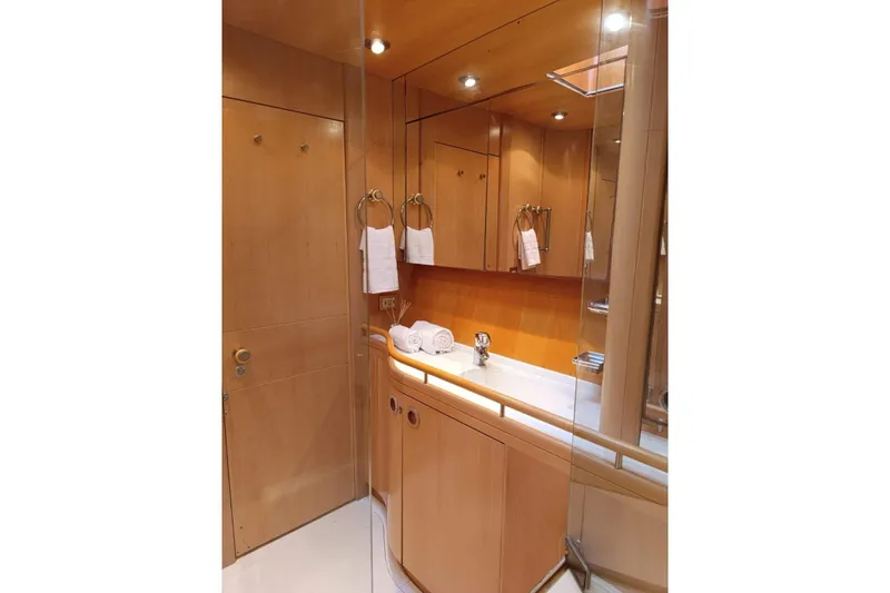 Persistence Yacht Photos Pics Luxurious 1989 Sensation yacht bathroom with wooden cabinetry and elegant fixtures.