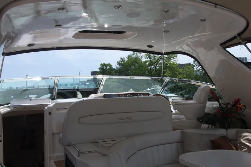  Yacht Photos Pics Interior view of 1997 Sea Ray 450 Sundancer yacht with elegant seating and dashboard.