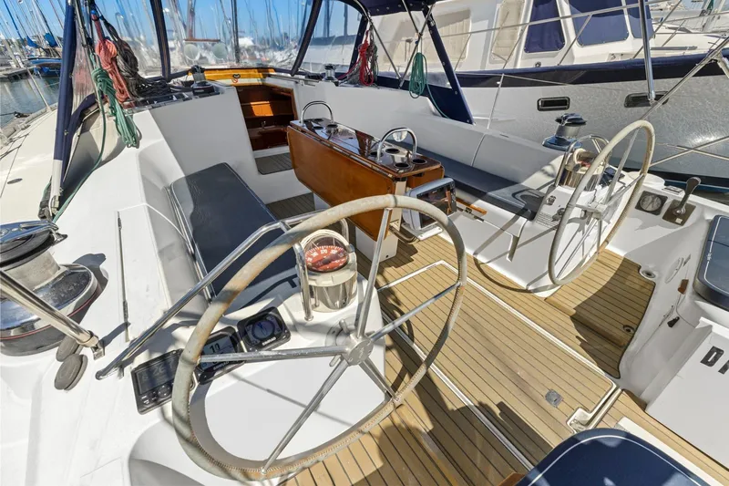Crazy Horse Yacht Photos Pics Cockpit of 2001 Jeanneau Sun Odyssey 52.2 sailboat with dual steering wheels.